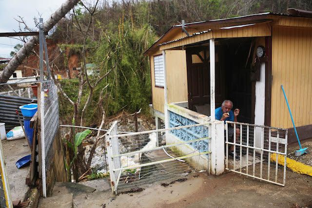 A man sits nearly three weeks after Hurricane Maria hit the island, on October 10, 2017 in Utuado, Puerto Rico. Most of the municipality is without running water or grid power. <br/>